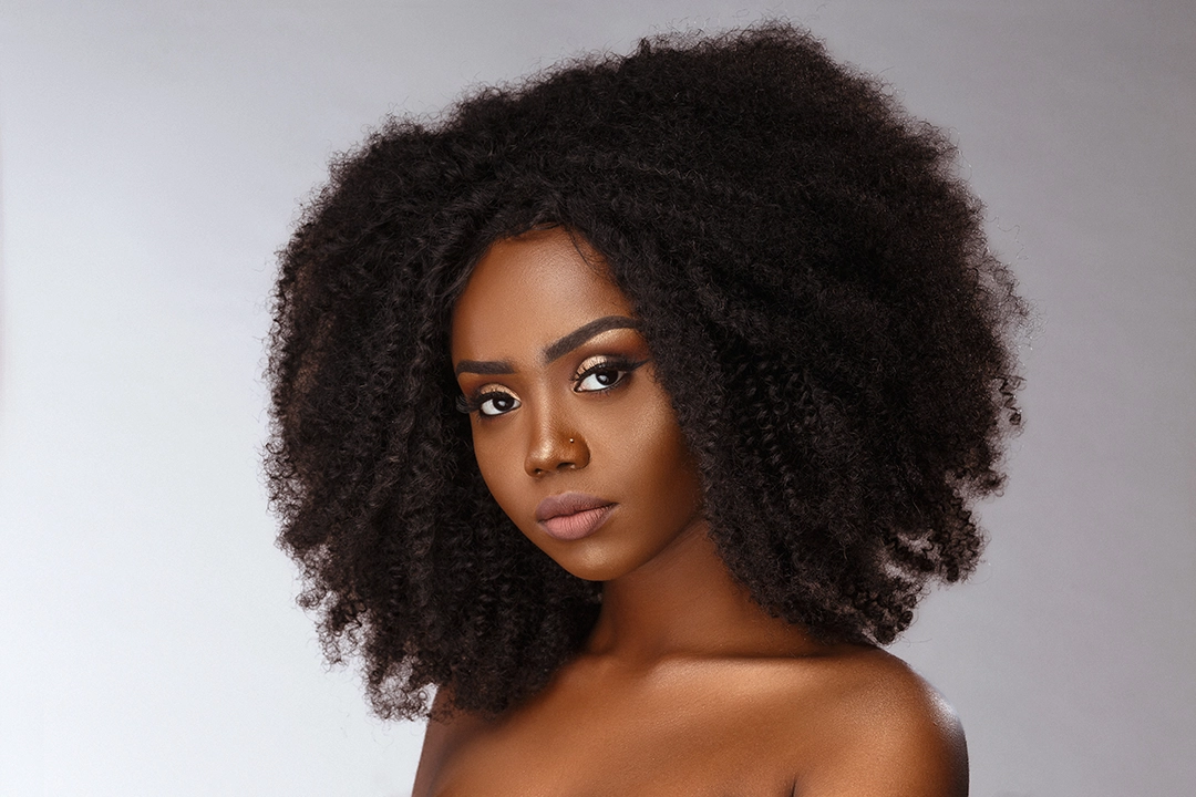 Close-up portrait with even skin, natural glow, and soft shadows